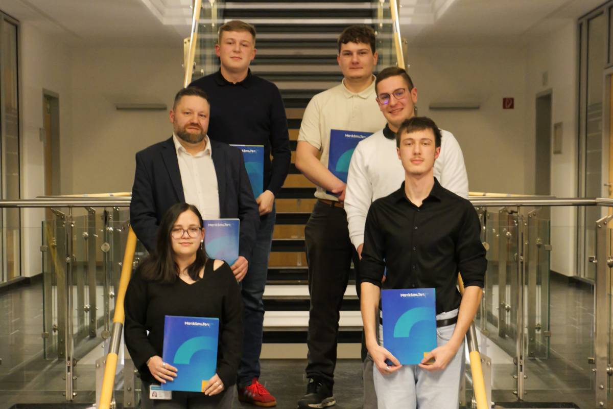 Ceremonial handover of certificates to the 2022 training cohort Cover